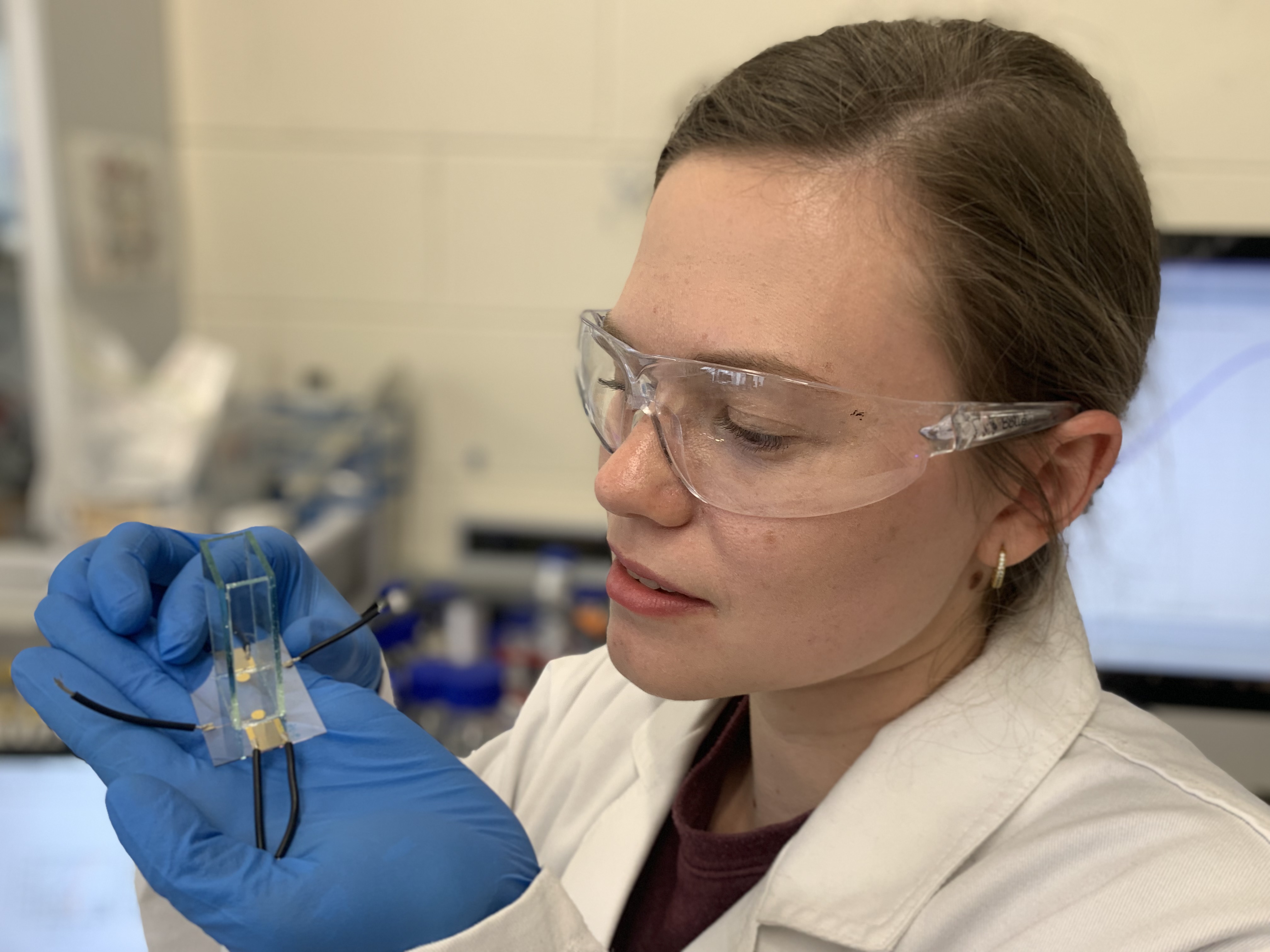 PhD researcher Yemima Ehrnst holding the acoustic device the research team used to boost the hydrogen production, through electrolysis to split water. Credit: RMIT University
