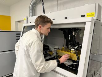 Curtin PhD candidate Anthony Clarke studying samples in the lab