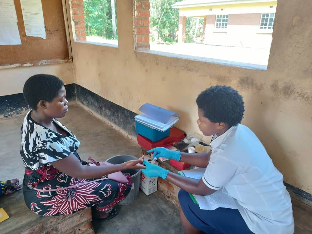 A study nurse screens a pregnant participant for anaemia by collecting a blood sample for haemoglobin.  Credit: Elisabeth Mamani-Mategula, the Training and Research Unit of Excellence (Malawi).