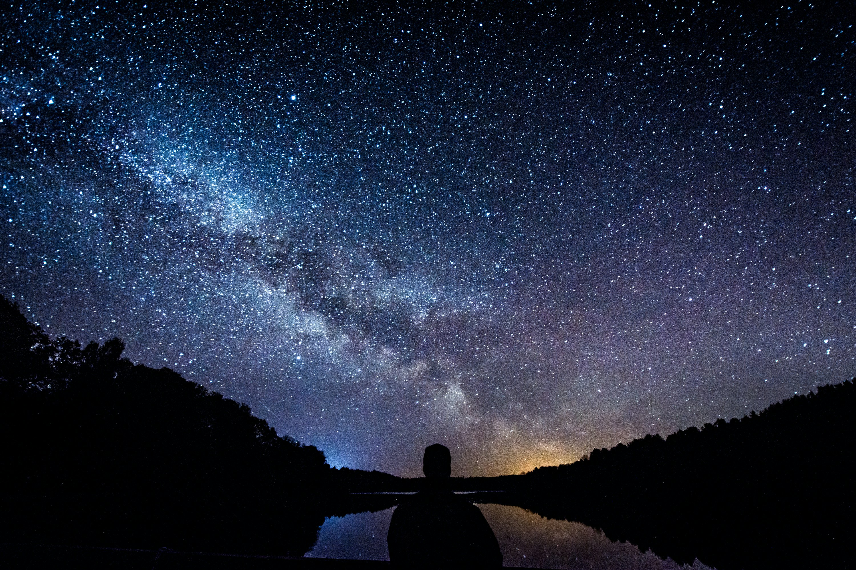 CC-0. https://unsplash.com/photos/silhouette-of-person-standing-under-starry-sky-ju-dVR1jkmE