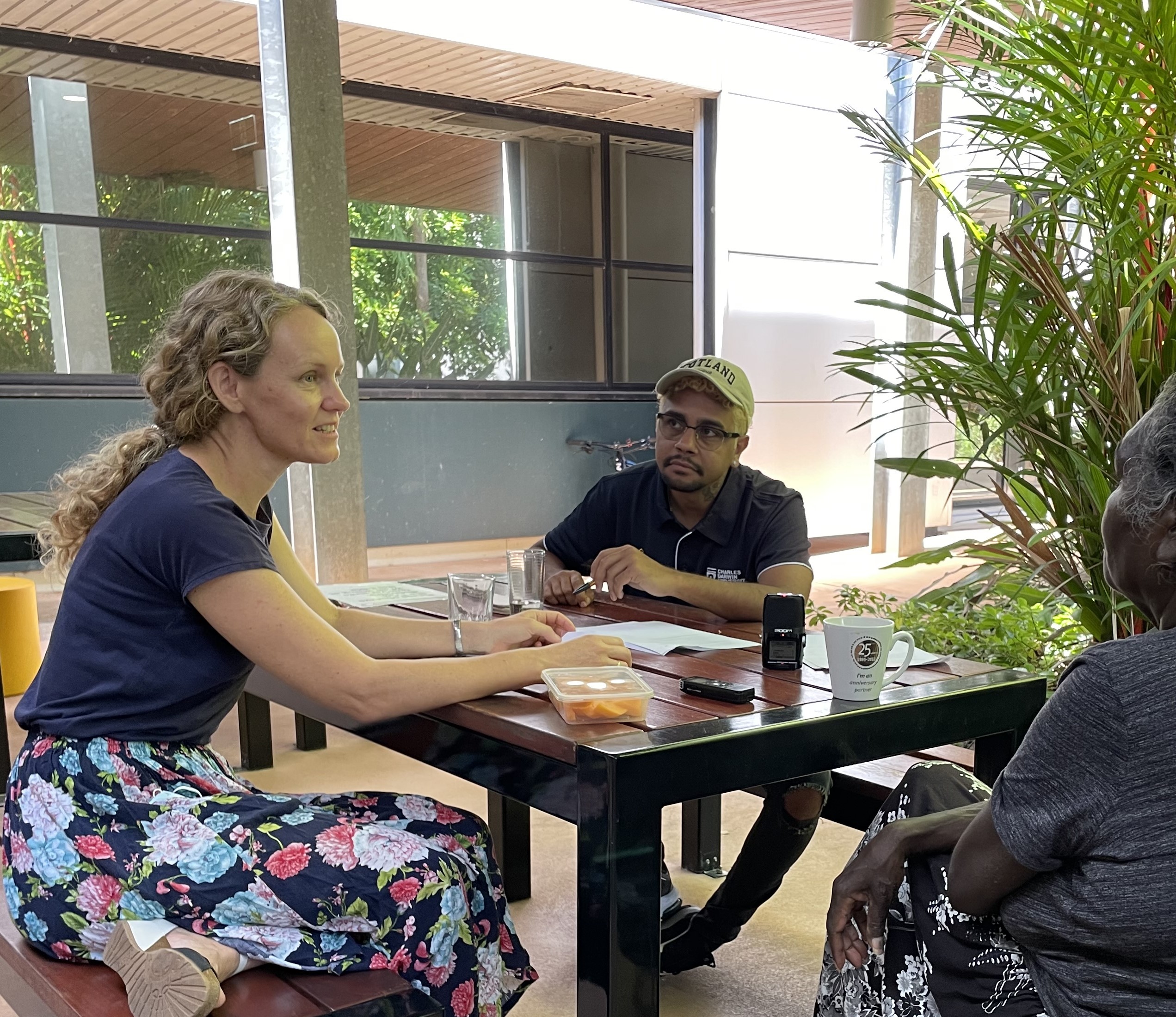 Caption: Menzies Researchers, Emily Armstrong and Stuart Yiwarr McGrath speaking with a patient about their experiences at Royal Darwin Hospital.