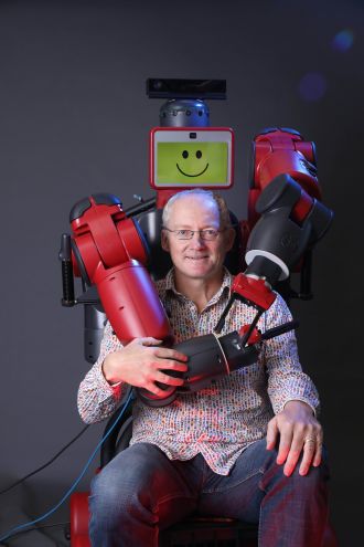 Prof Toby Walsh with a Baxter robot