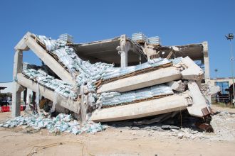 Partially collapsed full-scale precast building after testing. 