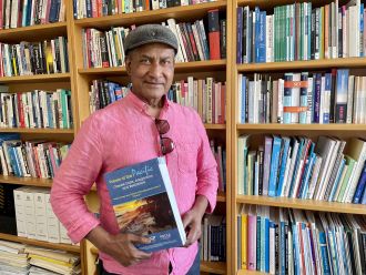 Professor Steven Ratuva with POCCA report 2