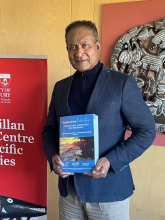 Professor Steven Ratuva with POCCA report
