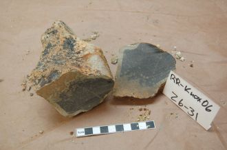 Grey pillow basalt with a brown alteration rim recovered by dredging 