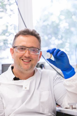 Dr Muller holding patch
