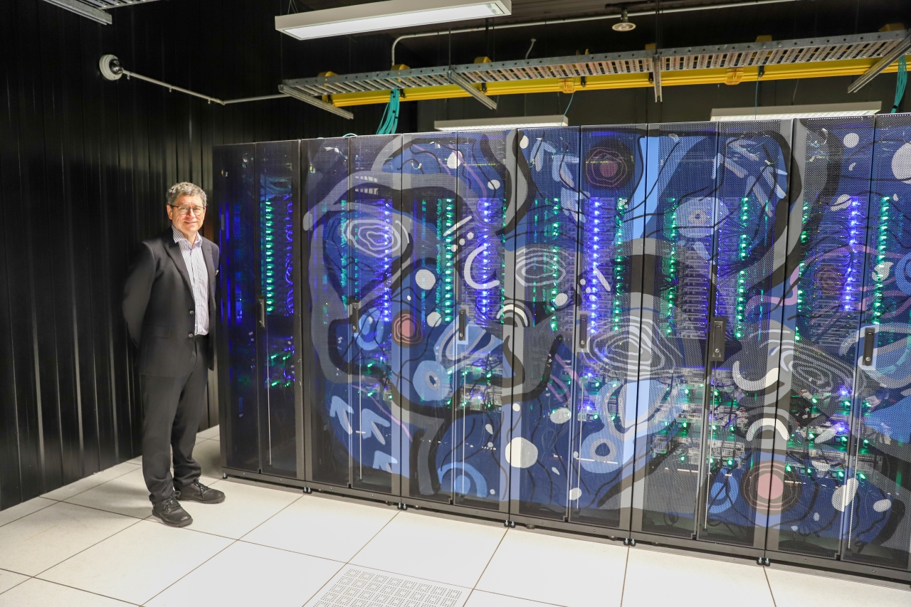 Professor Matthew Bailes with the supercomputer
