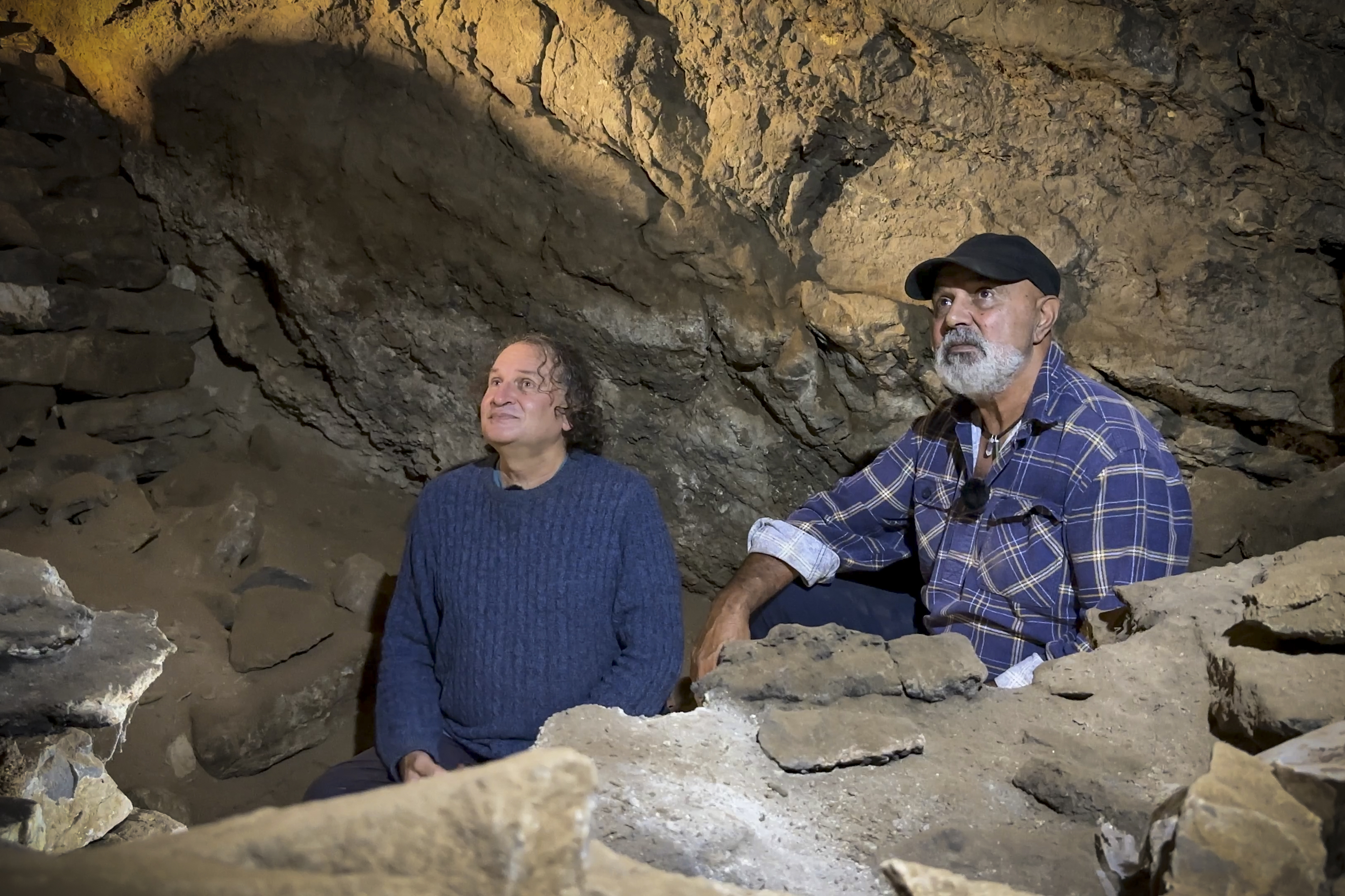 GunaiKurnai Elder Uncle Russell Mullett and Monash University's Professor Bruno David in Cloggs cave