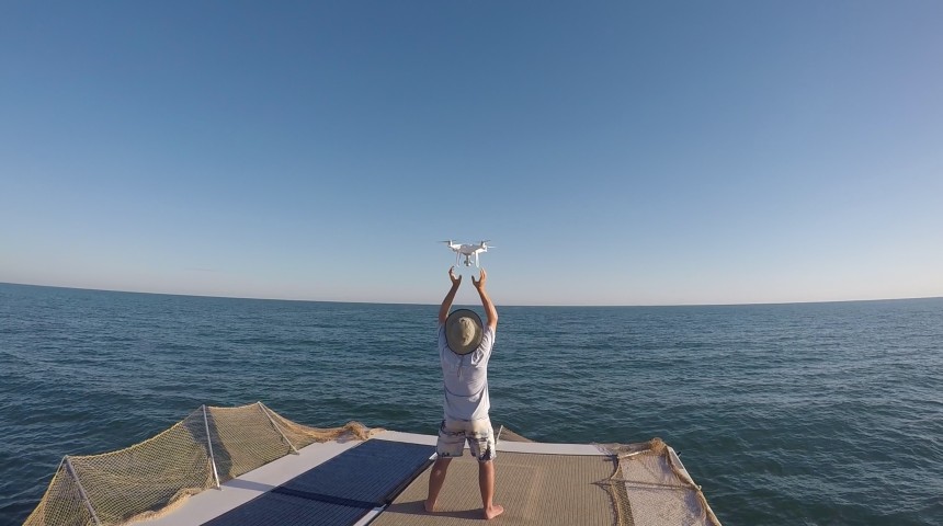Team member Dr Julian Tyne hand catching a Phantom 4 Pro after a survey flight © Christophe Cleguer.