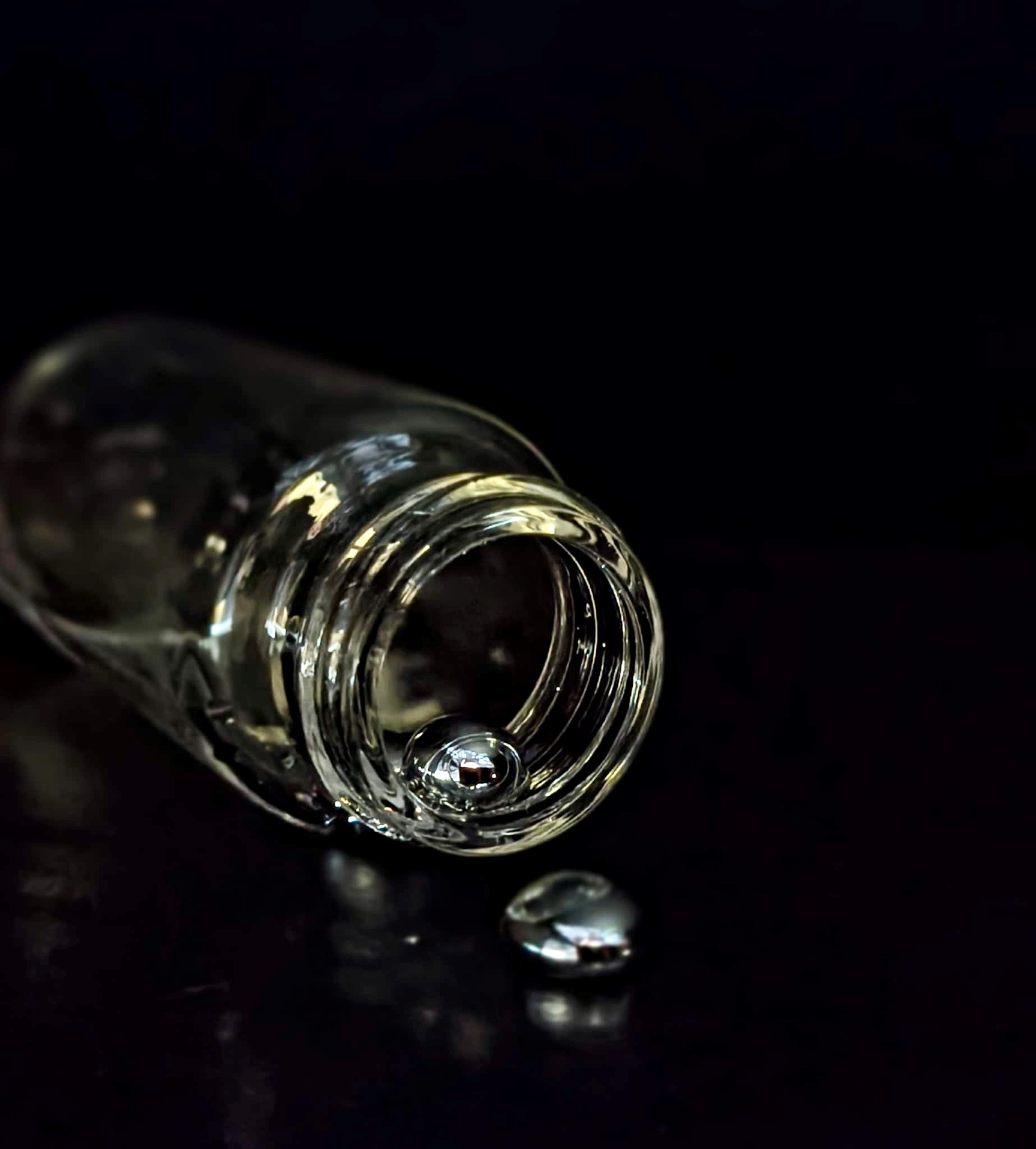 Image caption: liquid metal flowing from a vial 