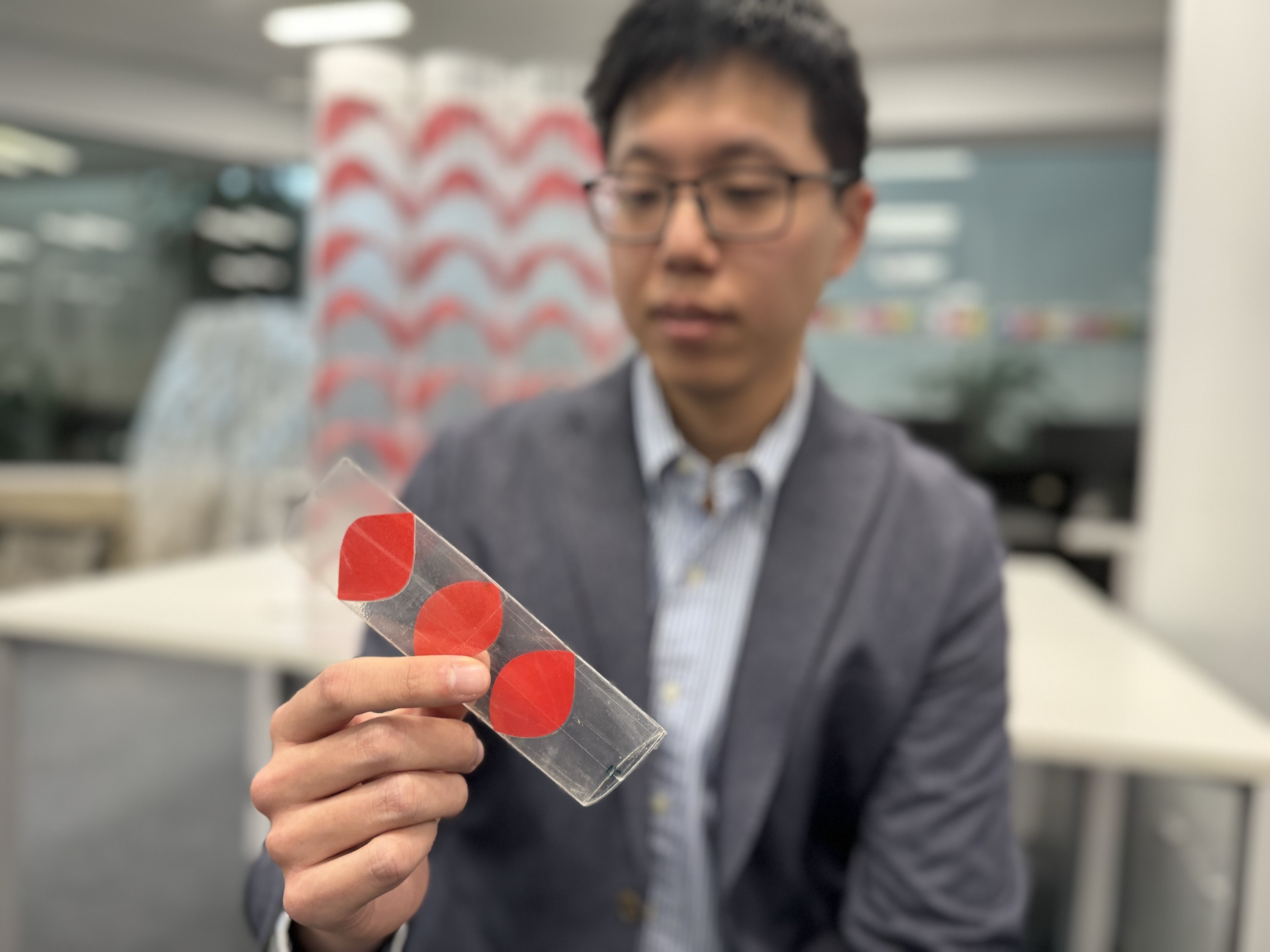 Dr Jeff Lee with a flat-pack tube. Credit: Will Wright, RMIT