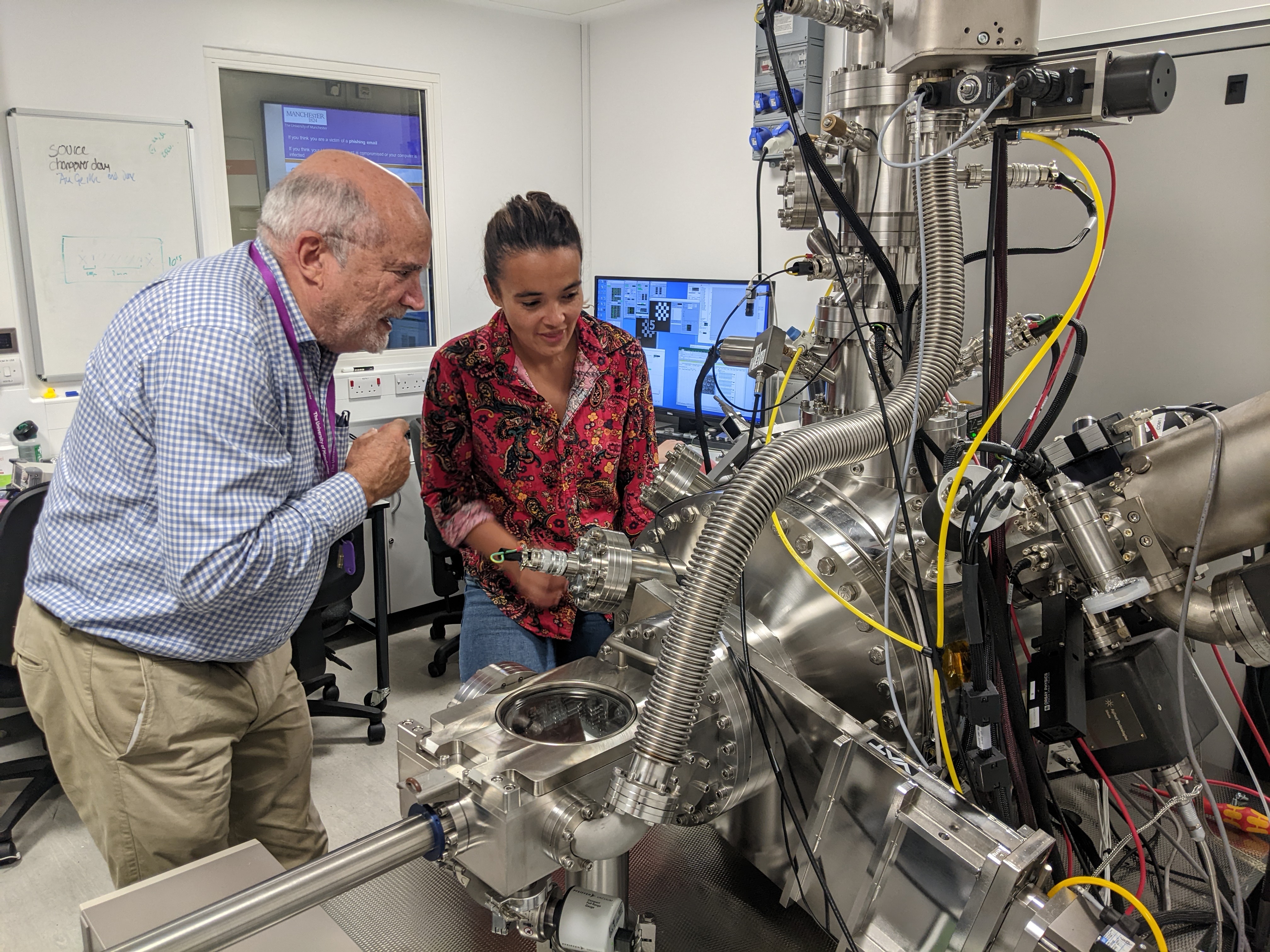 Credit: University of Melbourne / University of Manchester. Caption: Co-authors (left) Prof David Jamieson (University of Melbourne) and (right) Dr Maddison Coke (University of Manchester) inspect the P-NAME focused ion beam system at the University of Manchester used for the silicon enrichment project.
