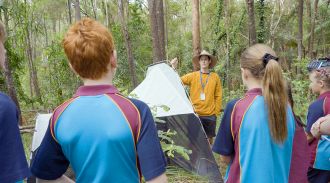 UniSC Dr Andy Howe with Beerwah SHS students and insect trap