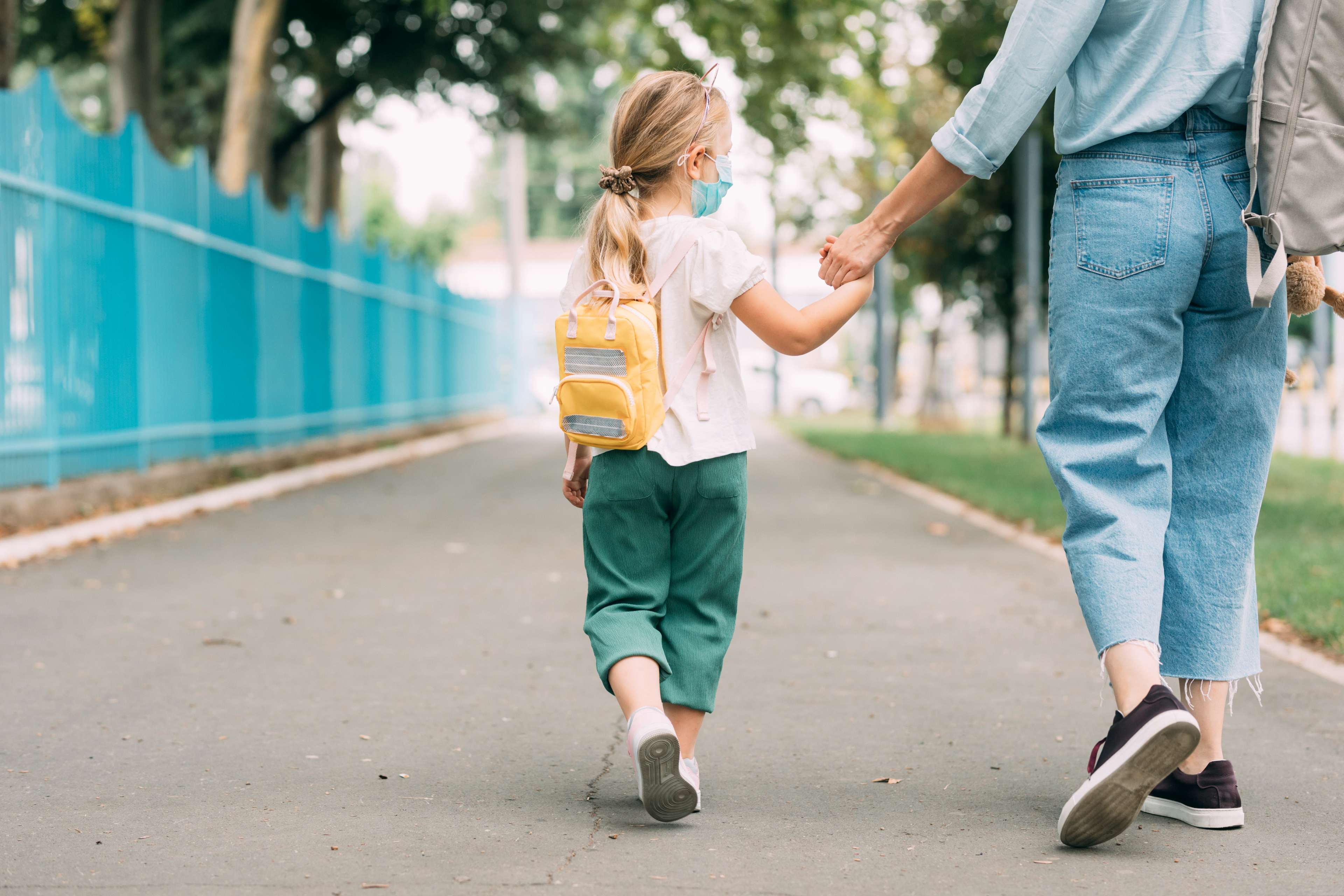 Child being taken to school. iStock image ID:1264365860 by FreshSplash.