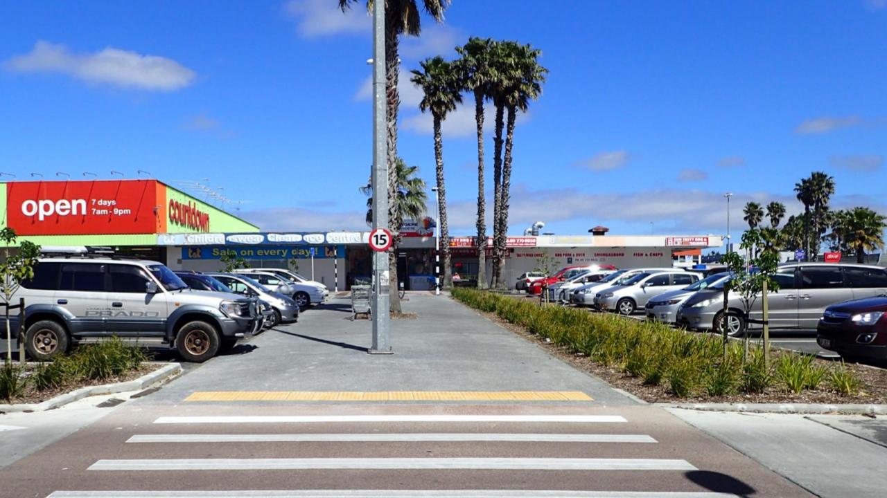 Town center on Mascot Ave after raised zebra pedestrian crossings through carpark 
