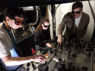 TMOS researchers at optical table