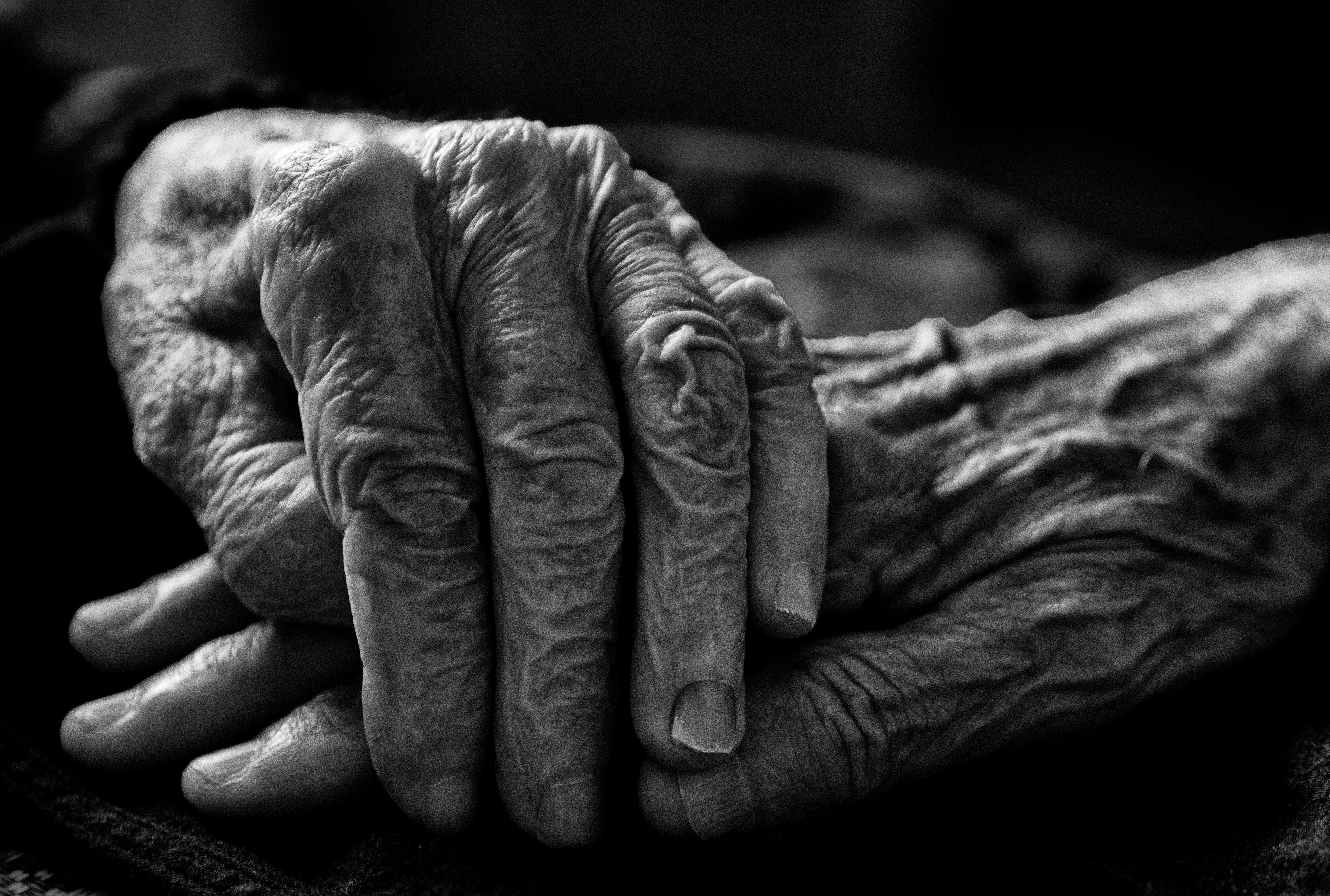 CC-0. https://www.pexels.com/photo/grayscale-photo-of-an-elderly-person-s-hands-7785175/
