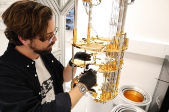 PhD student Tim Newman in a quantum lab