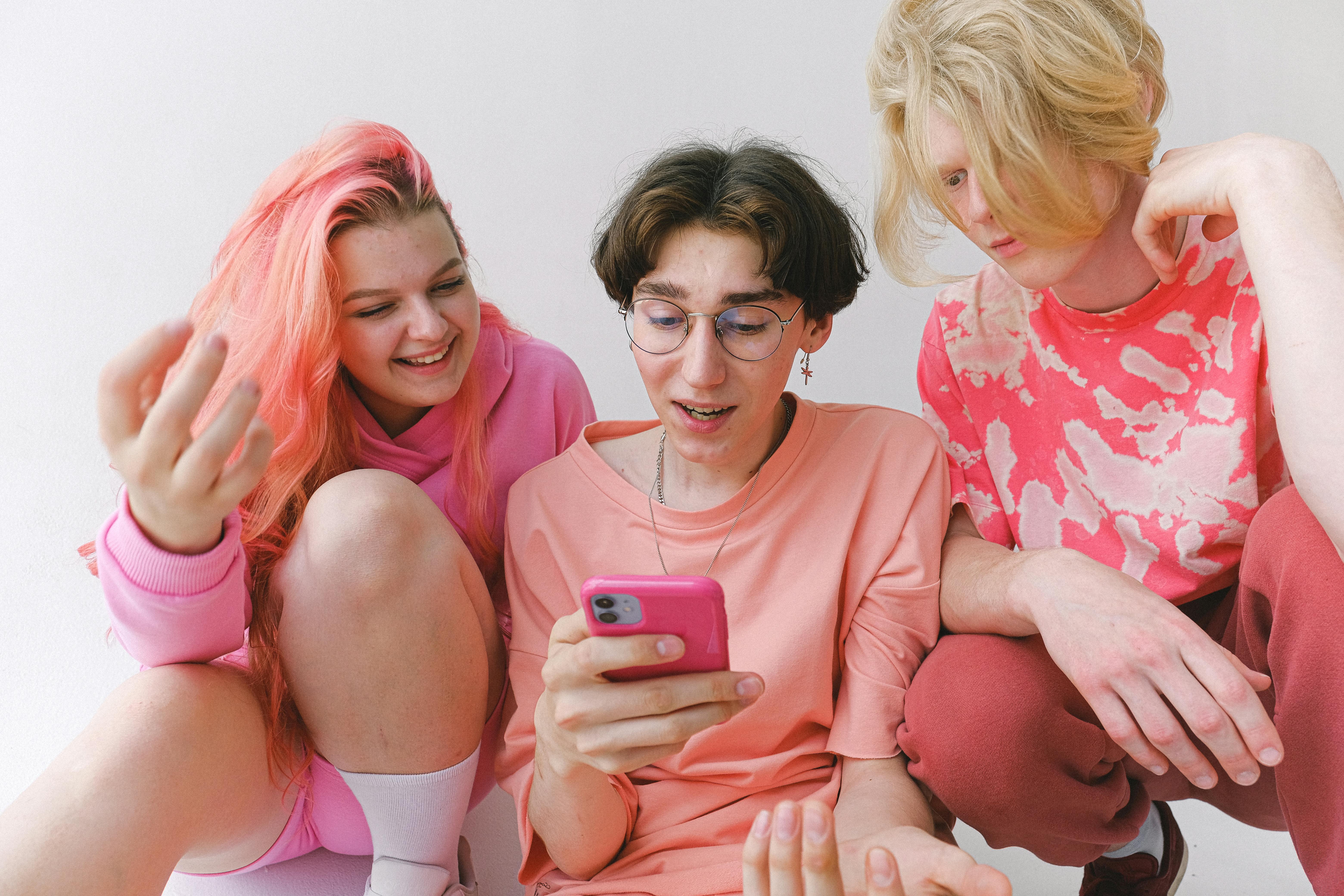 CC-0. https://www.pexels.com/photo/cheerful-teenagers-with-smartphone-looking-at-screen-5325601/