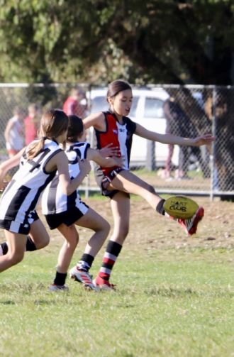 Indigenous kids playing football