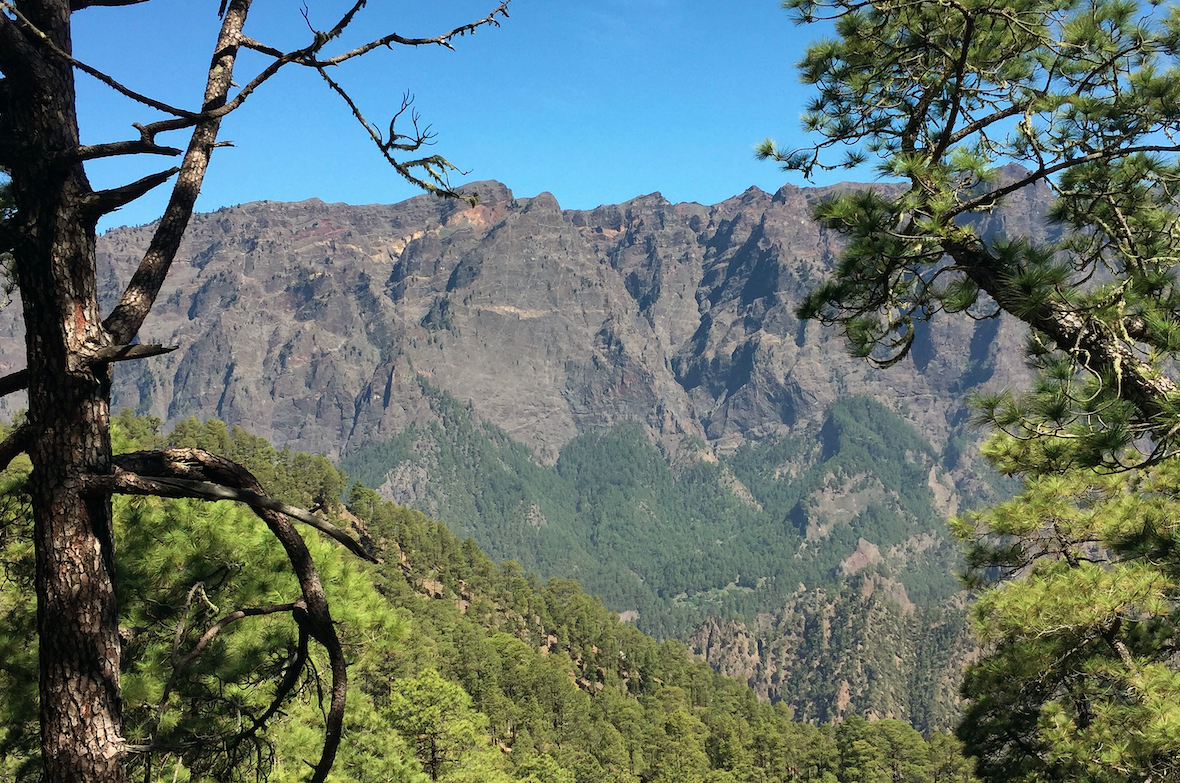 Caption: A 2km high cliff that exposes the core of the Tuburiente volcano - you can just see the igneous 'dykes' that transported magma inside the volcano. Credit: Professor Sandy Cruden