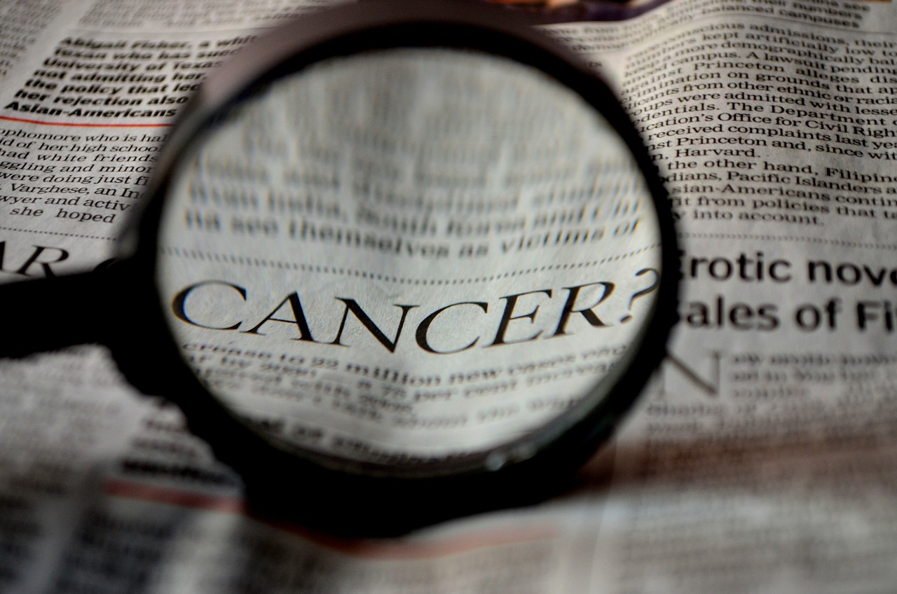 CC-0. https://pixabay.com/photos/cancer-newspaper-word-magnifier-389921/