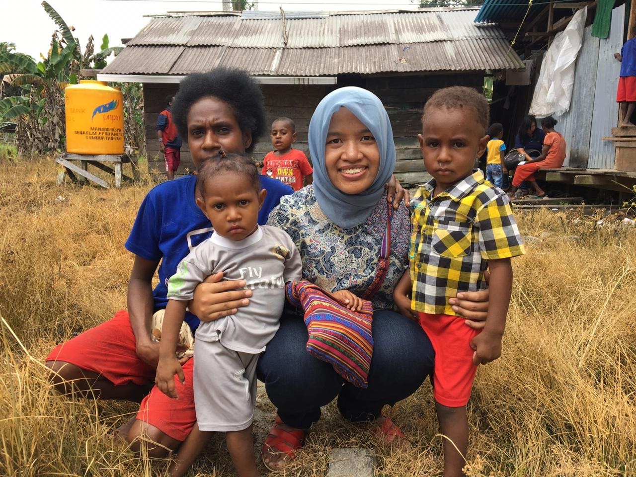  Dr Trisasi Lestari (centre) working with communities in Papua province, Indonesia.