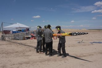 The team onsite at Texas during competition setting up Pardalote. 