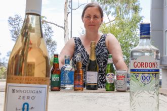 Dr Ashlea Bartram with zero-alcohol drinks that resemble alcoholic drinks