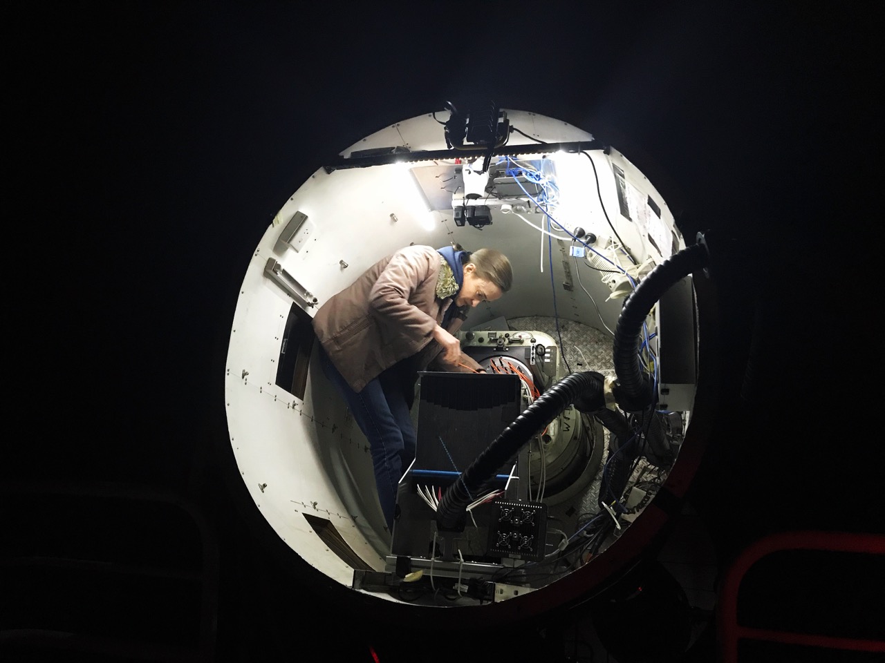 A/Prof Julia Bryant from the University of Sydney inside the SAMI instrument at the top end of the Anglo Australian Telescope. Credit: Scott Croom/University of Sydney