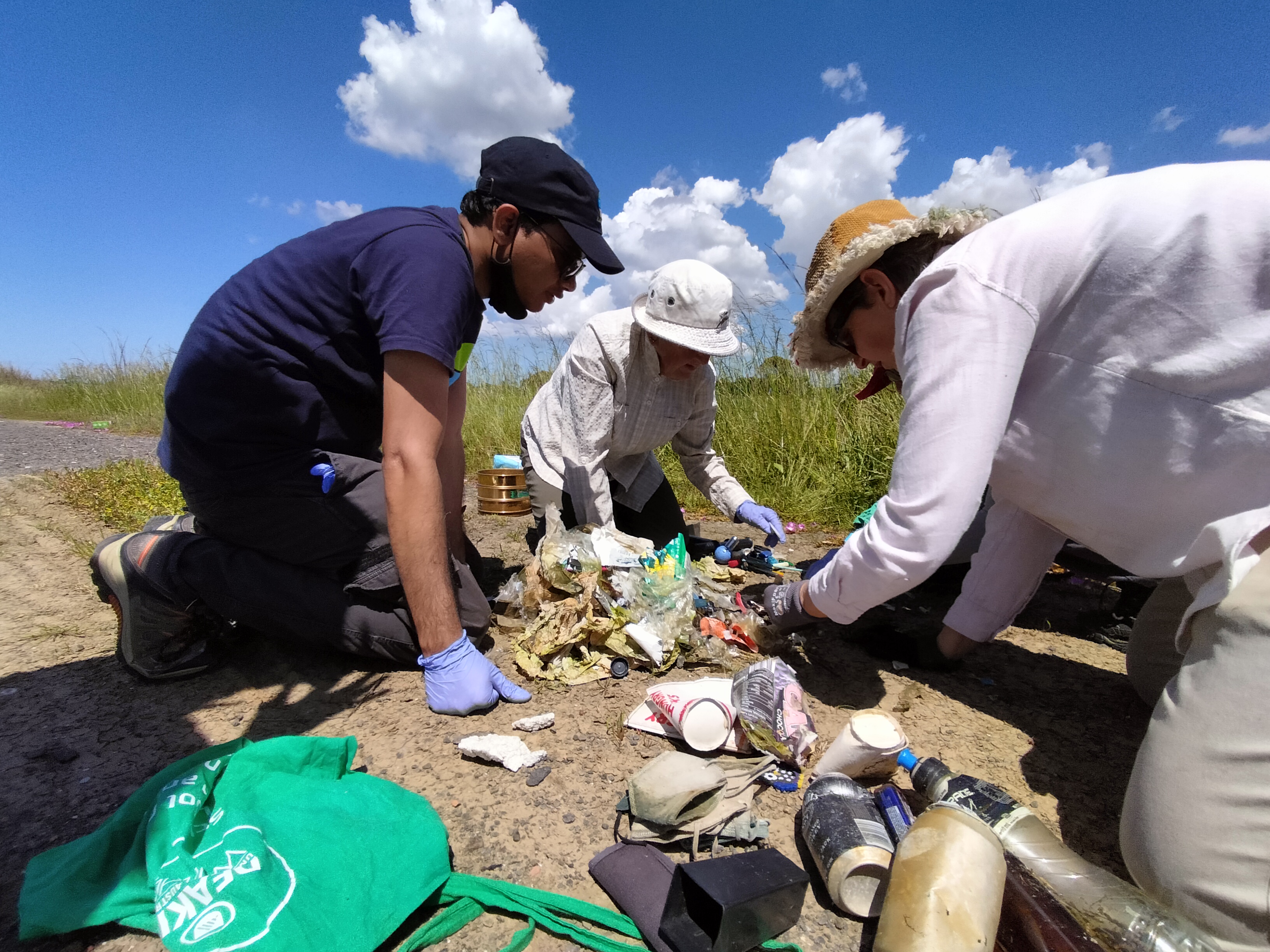 Dr Tanveer Adyel (left) working with citizen scientists to monitor microplastics at a wetland. Credit: supplied by the research team