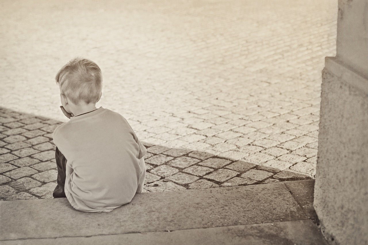 CC-0. Credit: FeeLoona on Pixabay - https://pixabay.com/photos/lonely-boy-child-sad-604086/