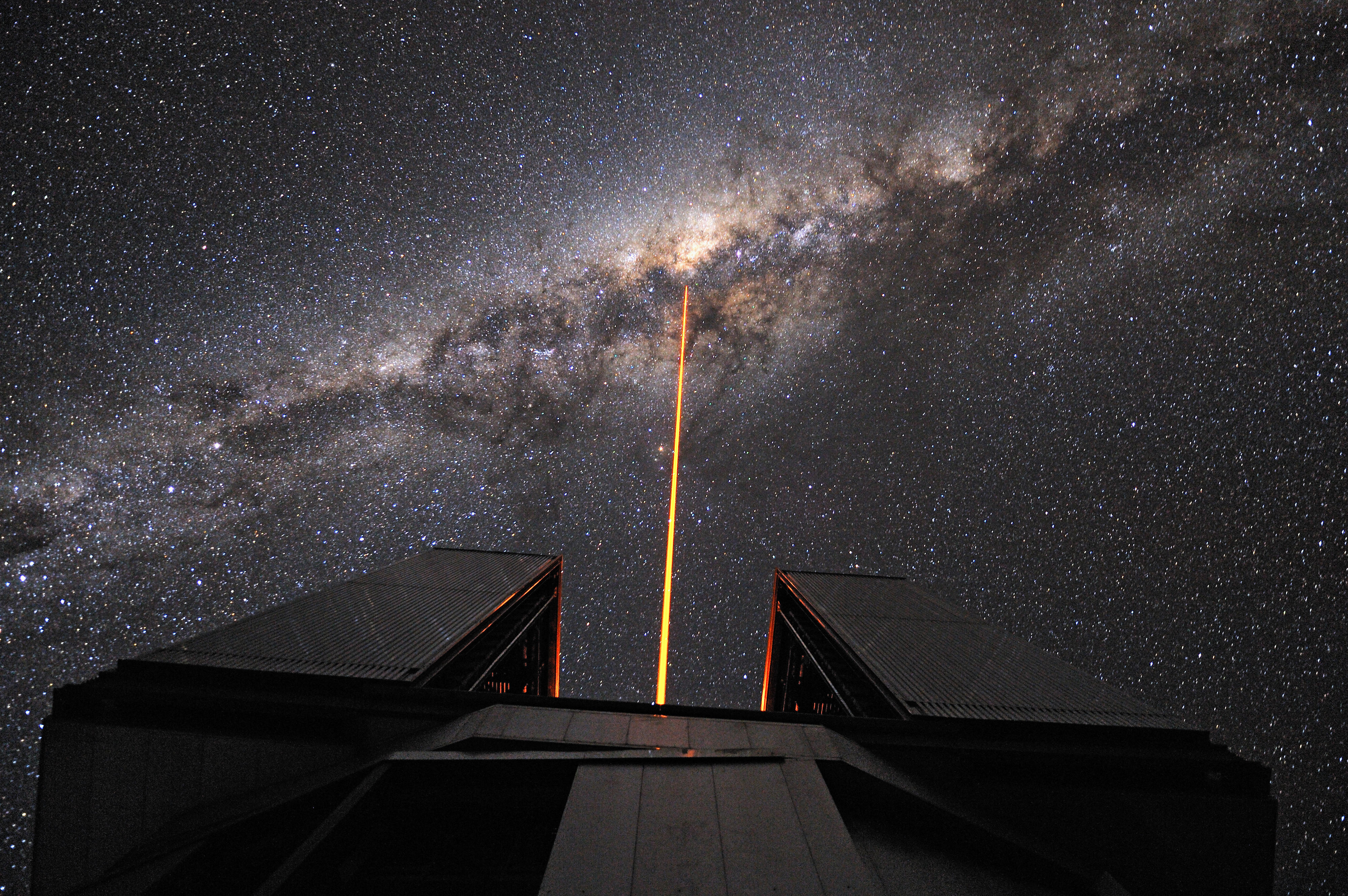 The Laser Guide Star (LGS) is launched from the VLT's 8.2-metre Yepun Telescope and aims at the centre of our galaxy.  Credit: G. Hüdepohl (atacamaphoto.com)/ESO