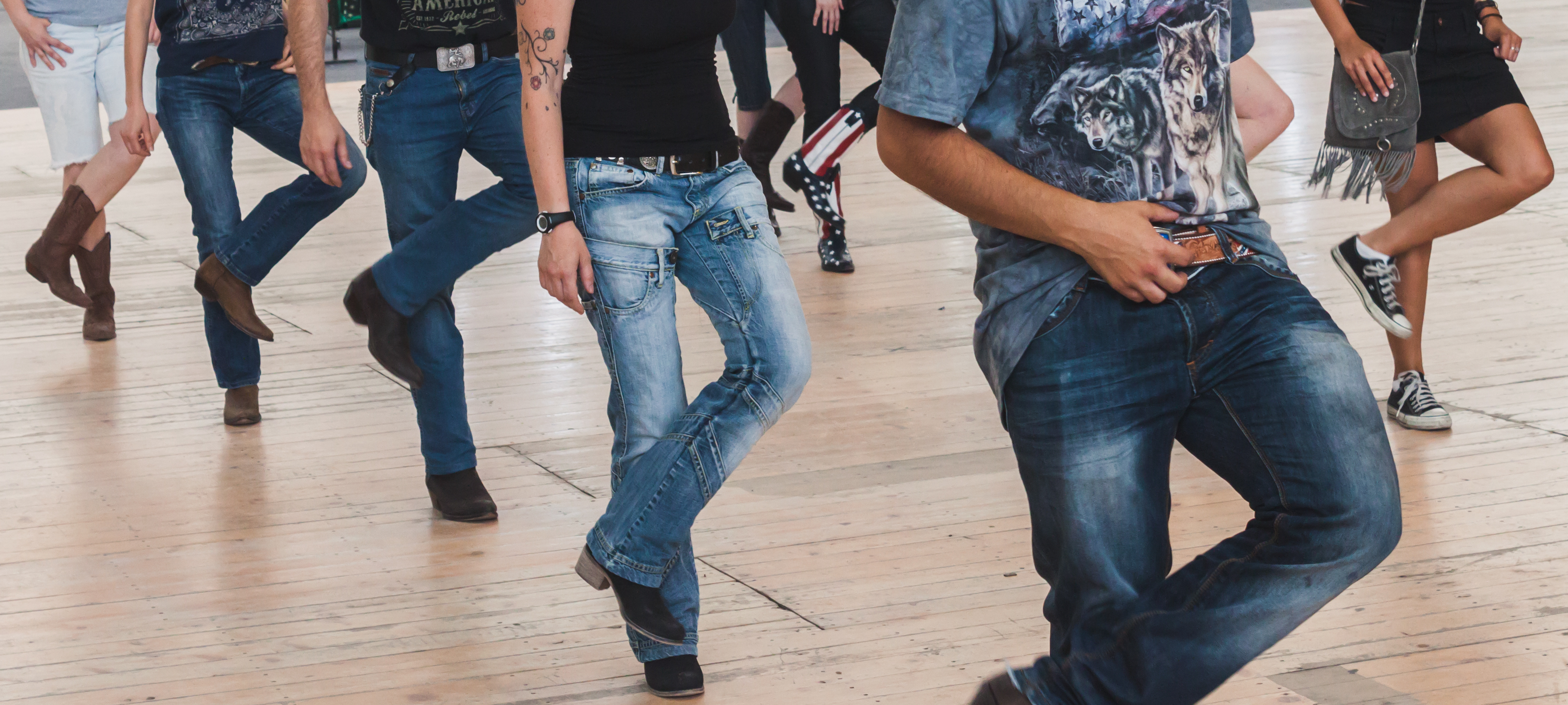 Line dancing is an example of synchronicity. Shutterstock.