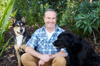 Professor Paul McGreevy with two dogs