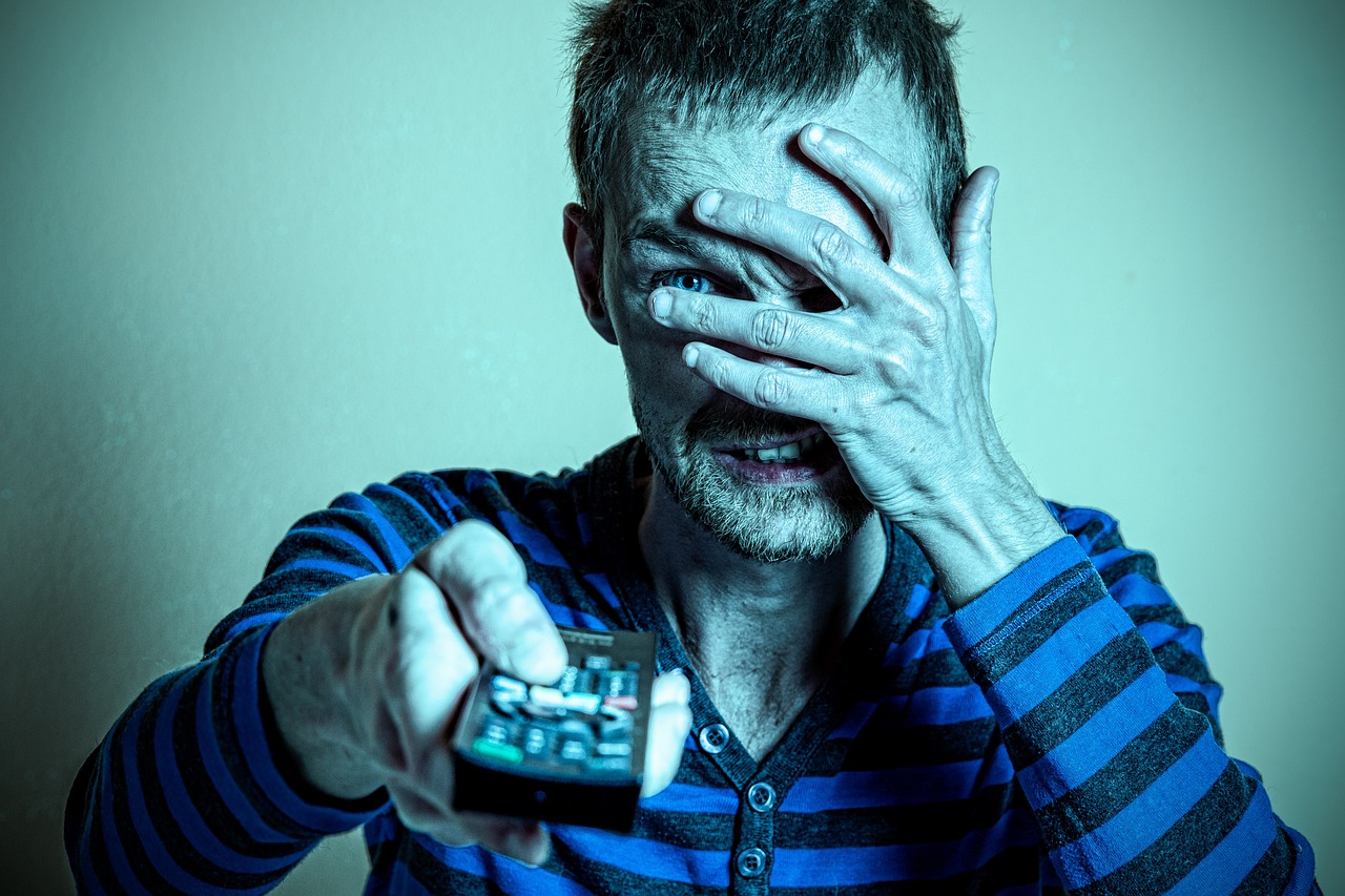 CC-0. https://pixabay.com/photos/man-tv-watching-remote-watching-tv-5892134/