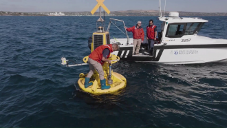 SARDI research team replace one of the water sensors on the AquaWatch buoy in th